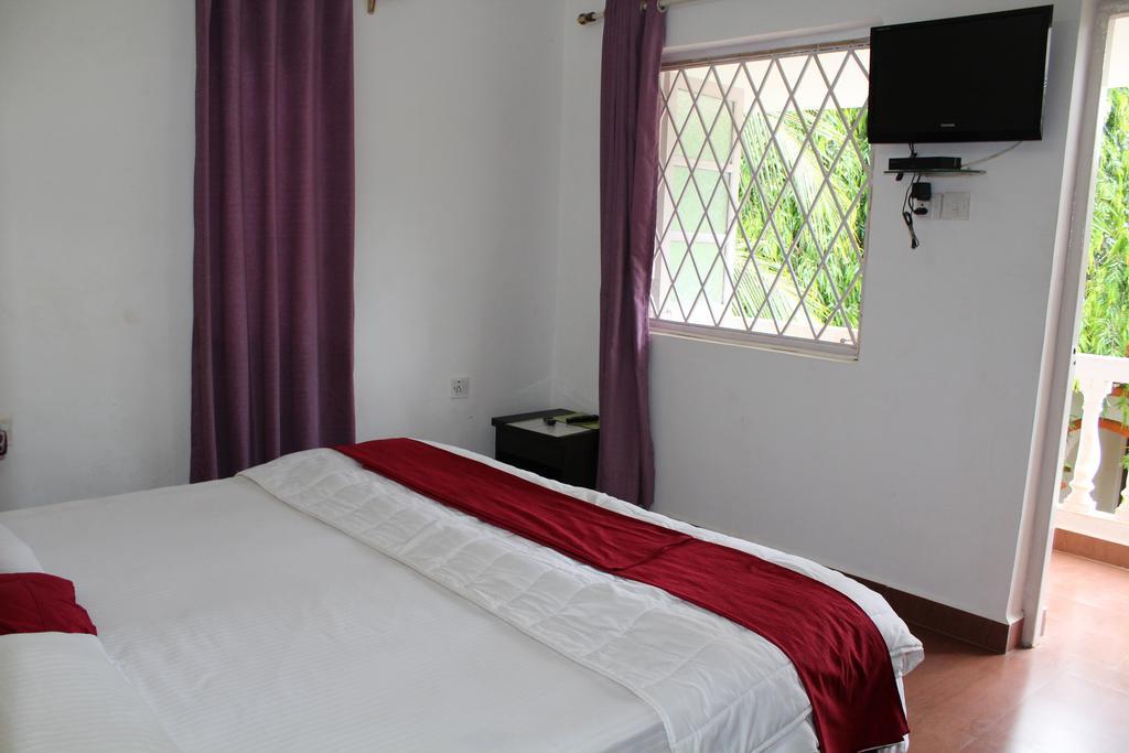 Sugar Plum Macedo Palms Bed & Breakfast Baga Bilik gambar
